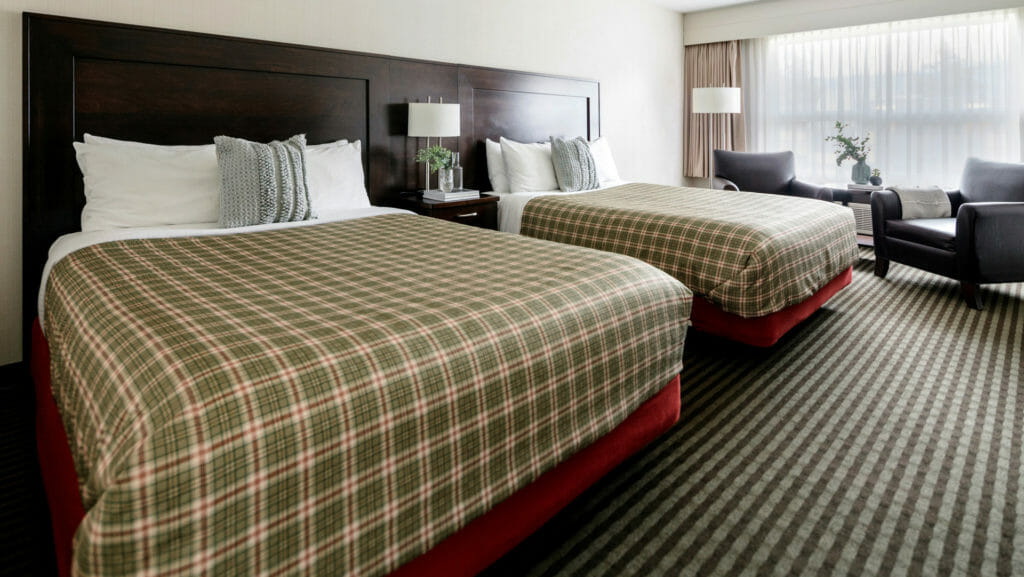 The Deluxe Room features sleek, modern decor, a queen or king bed, microwave, mini fridge,  air conditioning, HD television, a stand-up shower, eco-friendly bathroom amenities, a hair dryer, complimentary coffee, tea and high speed internet.